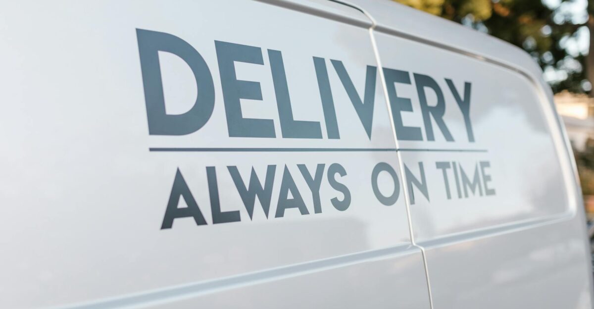 Close-up of delivery van with slogan Always On Time emphasizing timely service