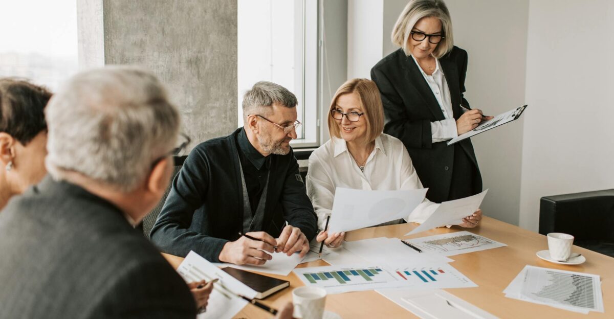 A diverse group of business professionals engaged in a strategic meeting