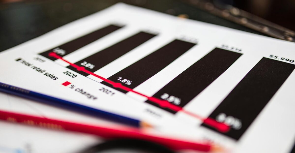 Close-up of a financial report showing sales data with dramatic depth of field