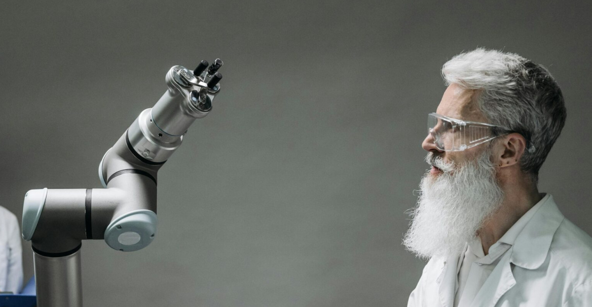 Two scientists working with a robotic arm in a lab setting, focusing on innovation and technology.