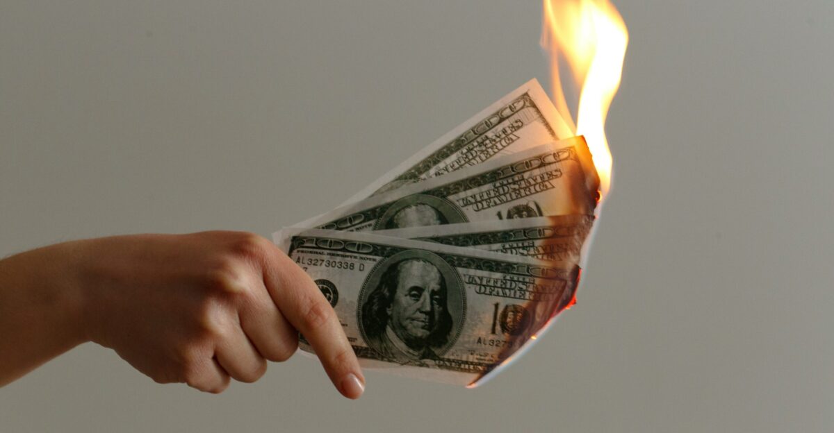 burned 100 US dollar banknotes