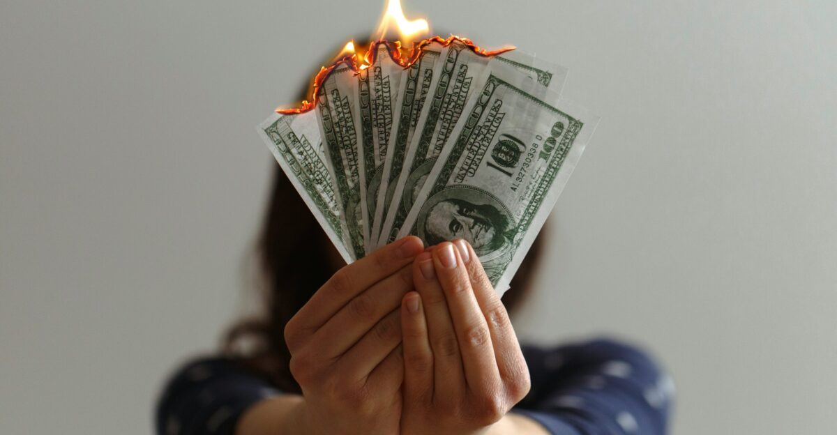 a fan of fake American dollars on fire