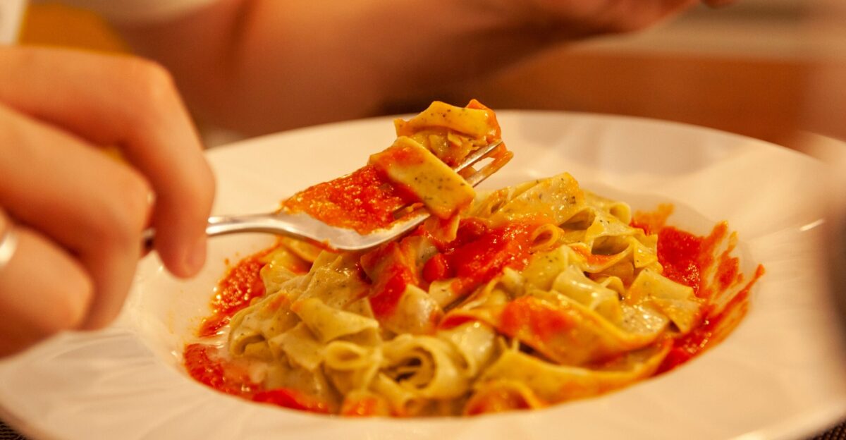 pasta with sauce on white ceramic plate