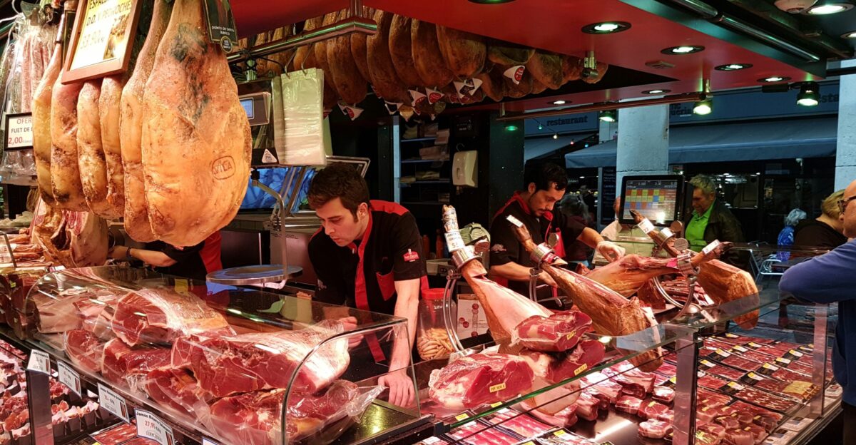 people standing in front of food display counter