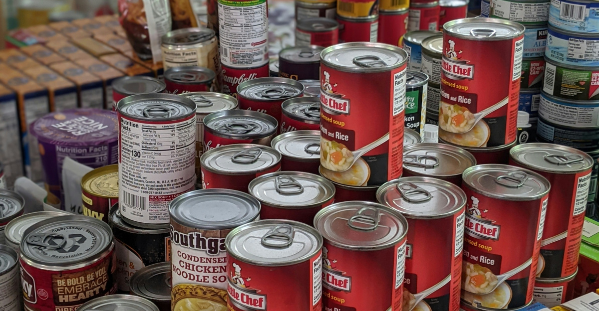 red and white labeled cans