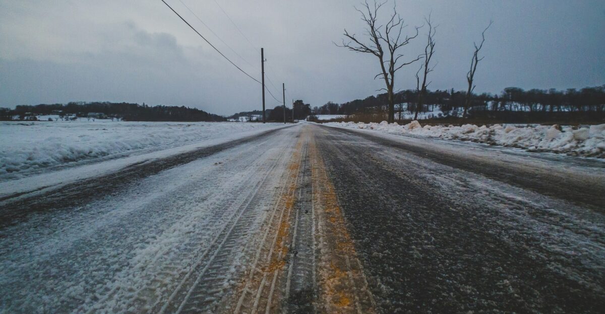 snow covered road during daytime