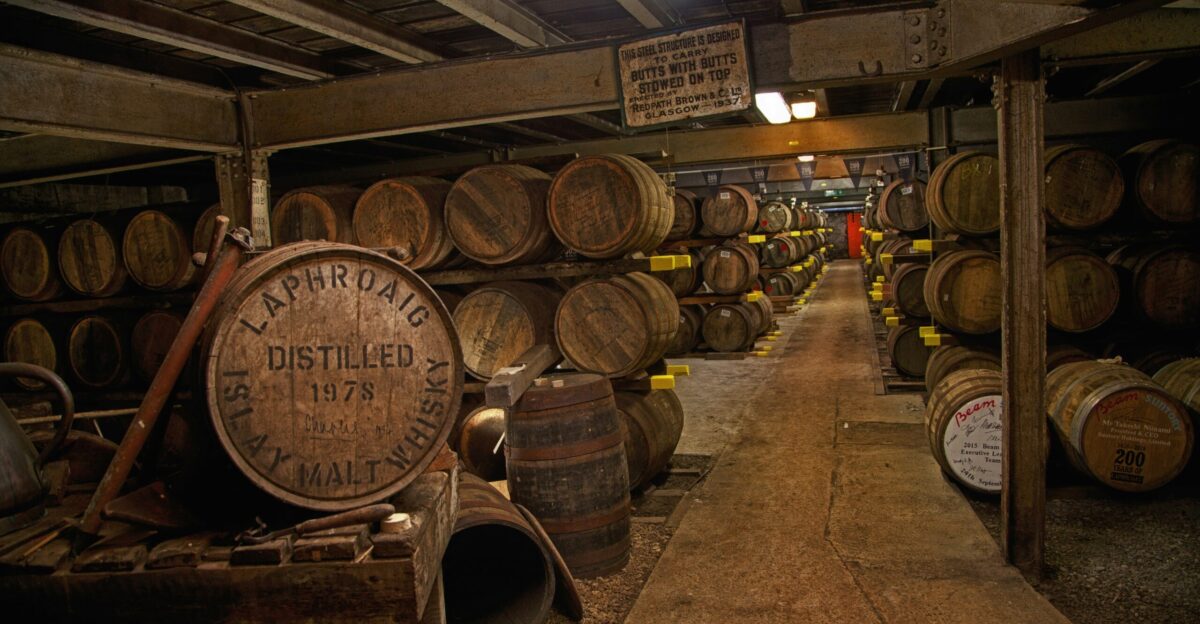 a room filled with lots of wooden barrels