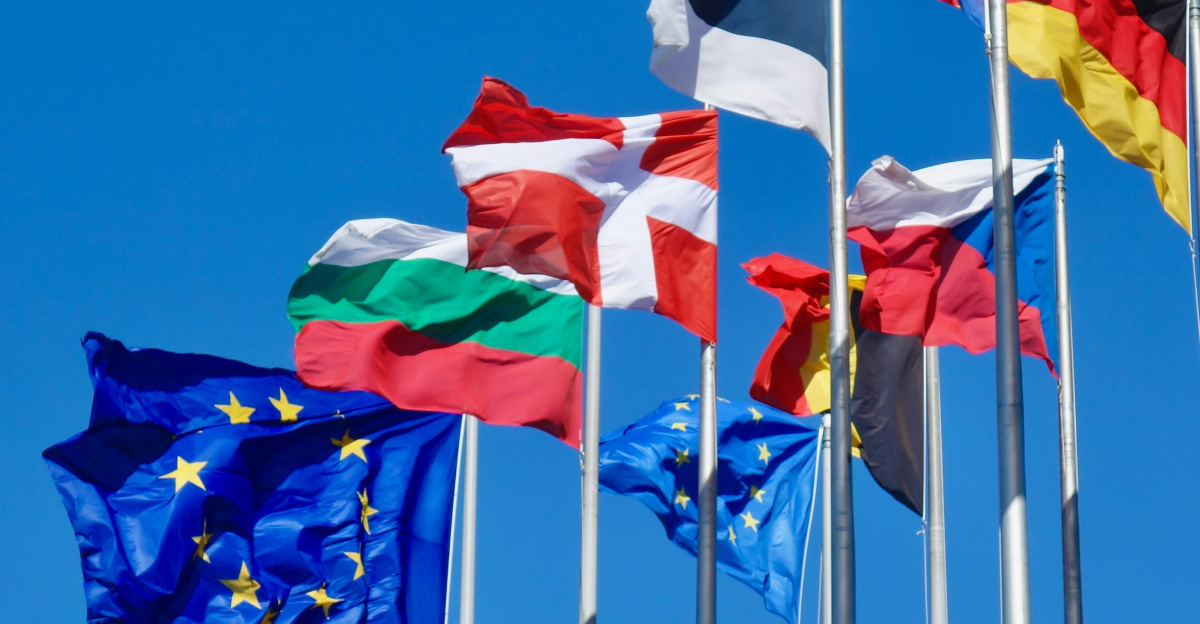 a bunch of flags that are flying in the air