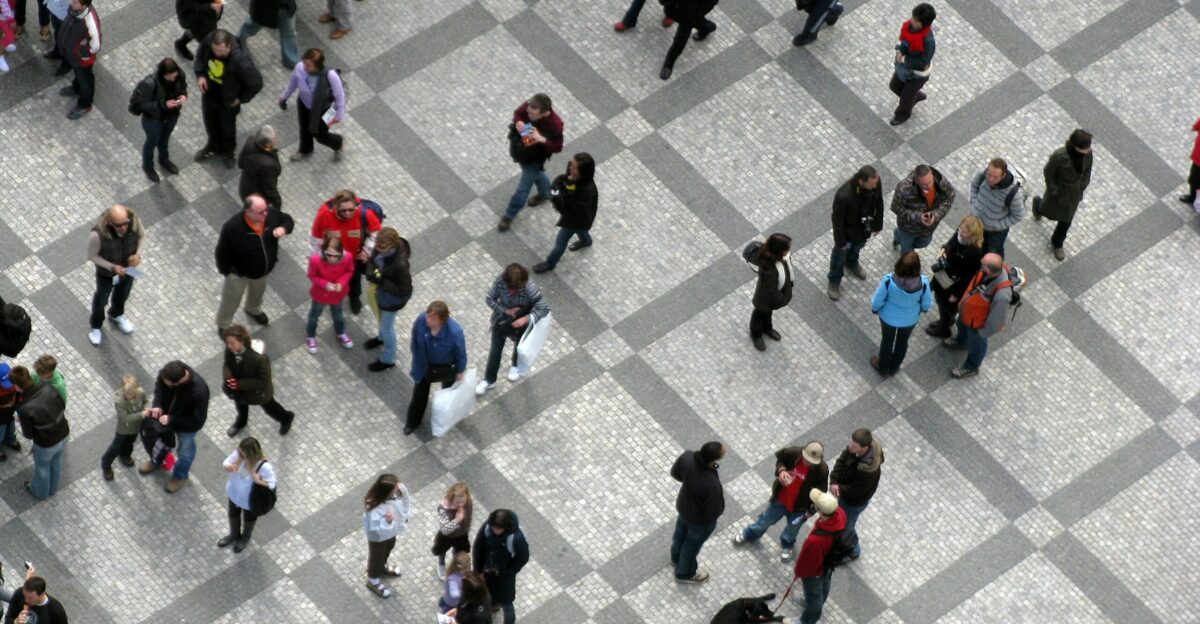 a group of people walking on a street