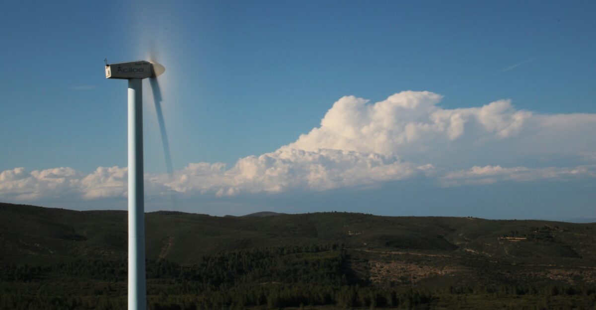 a wind turbine in the middle of a field