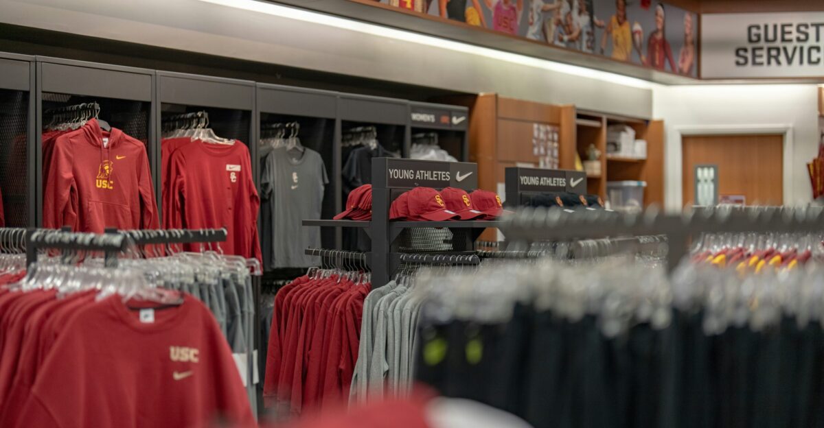 a store filled with lots of red and black shirts
