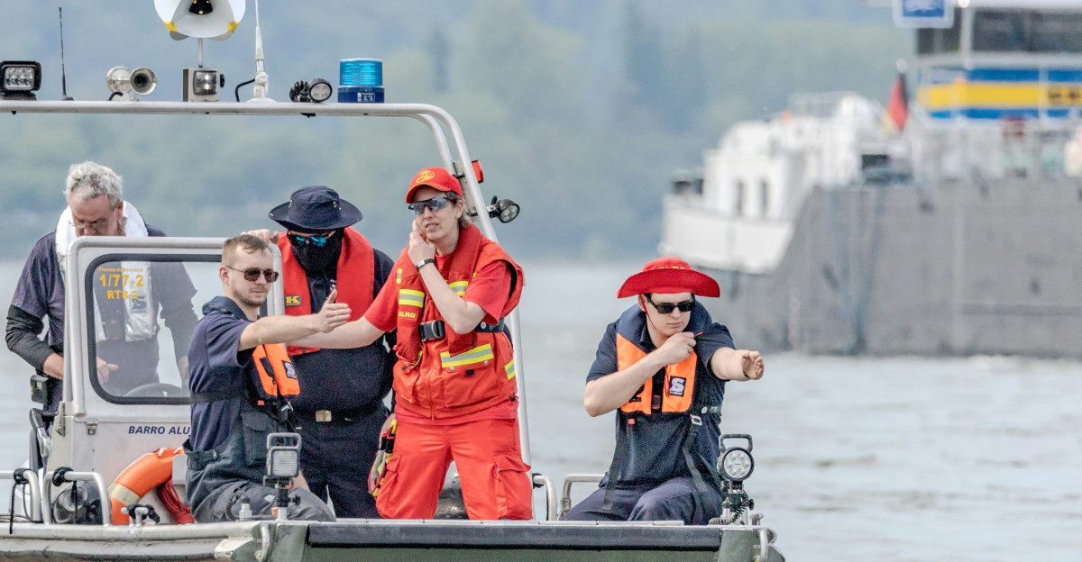 a group of people on a boat in the water