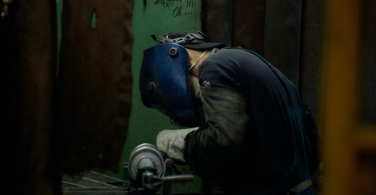 A man working on a machine in a factory