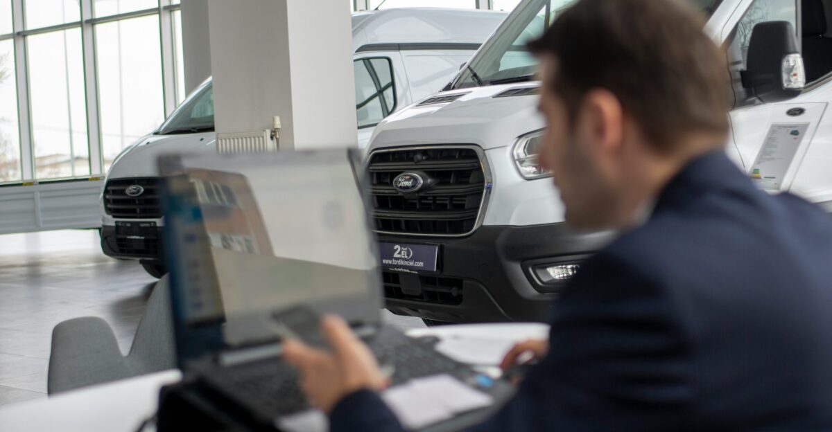 A man sitting in front of a laptop computer