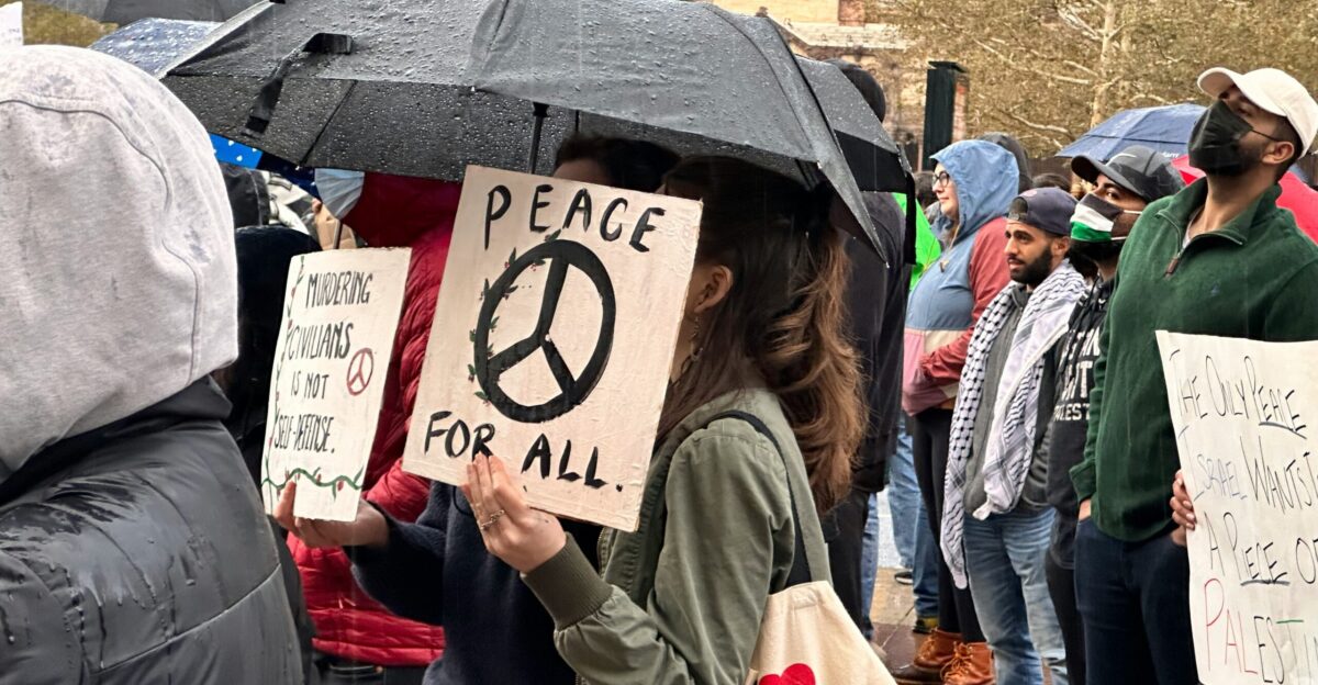 People protest for peace with signs