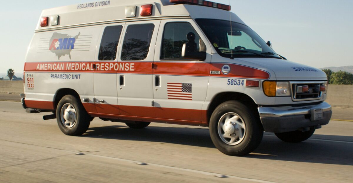 American medical response ambulance driving on highway