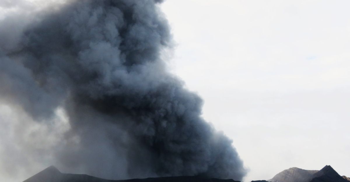 The crater in the photo is the crater of Mount Bromo which was spewing thick black smoke, and volcanic ash.
