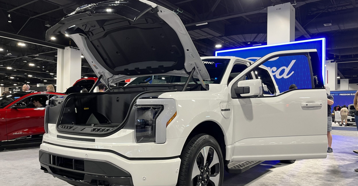 Front left quarter view of a 2023 Ford F-150 Lightning at the 2023 Denver Auto Show.