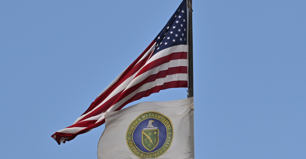 The flag for the U S Department of Energy flying below the United States Flag on a flagpole 1000 Independence Avenue SW Washington DC 20585
