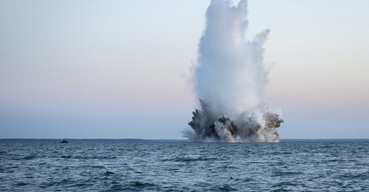 Members of a Latvian explosive ordnance disposal team use demolition charges to detonate a World War II-era German bottom-mine while conducting mine countermeasures operations in the Baltic Sea off the coast of Estonia during Exercise Open Spirit 2015 The U S Navy unit EODMU-8 was working in conjunction with explosive ordnance disposal teams from Estonia Germany Latvia Lithuania Poland and Sweden to dispose of unexploded ordnance originating from World War II