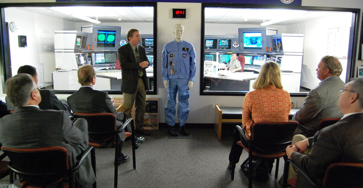 Boulder CO February 24 2010 - At the NOAA space Weather Prediction Operations Center Space weather forecaster Bill Murtagh briefs workshop participants outside NOAA s operations center in Boulder Colo Attendees at the two-day event discussed transatlantic preparedness for critical incidents such as geomagnetic storms FEMA Jerry DeFelice