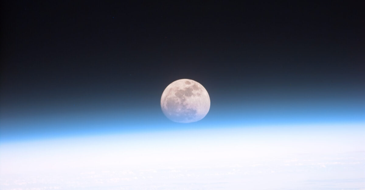 Original caption from NASA S103-E-5037 21 December 1999 - Astronauts aboard the Space Shuttle Discovery recorded this rarely seen phenomenon of the full Moon partially obscured by the atmosphere of Earth The image was recorded with an electronic still camera at 15 15 15 GMT Dec 21 1999