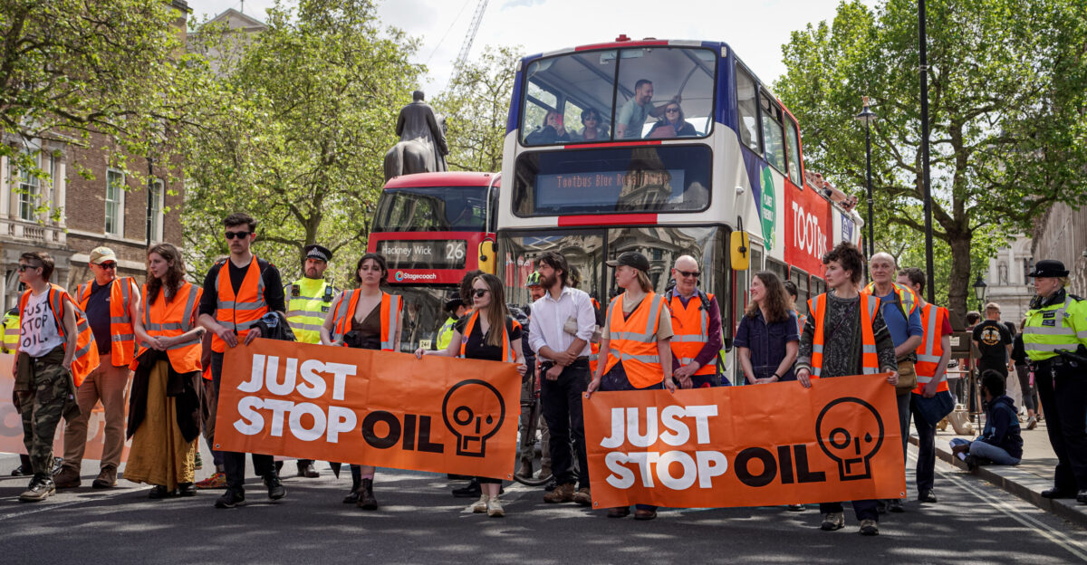 Just Stop Oil activists walking up Whitehall towards Trafalgar Square on Saturday 20 May 2023 - I should add that they seemed to allow at least some of the buses to pass them The Just Stop Oil message to the UK Government is to lobby for the end of new investment in oil fields and production instead turning to green sources of energy Tactics include slowly marching along a road as in this case dressed in orange hi-vis jackets and carrying their simple Just Stop Oil message on banners Activists have been subject to assaults by motorists and others as well as surveillance and arrest for peacefully protesting Penalties faced include prison sentences and fines under the newly passed Public Order Act