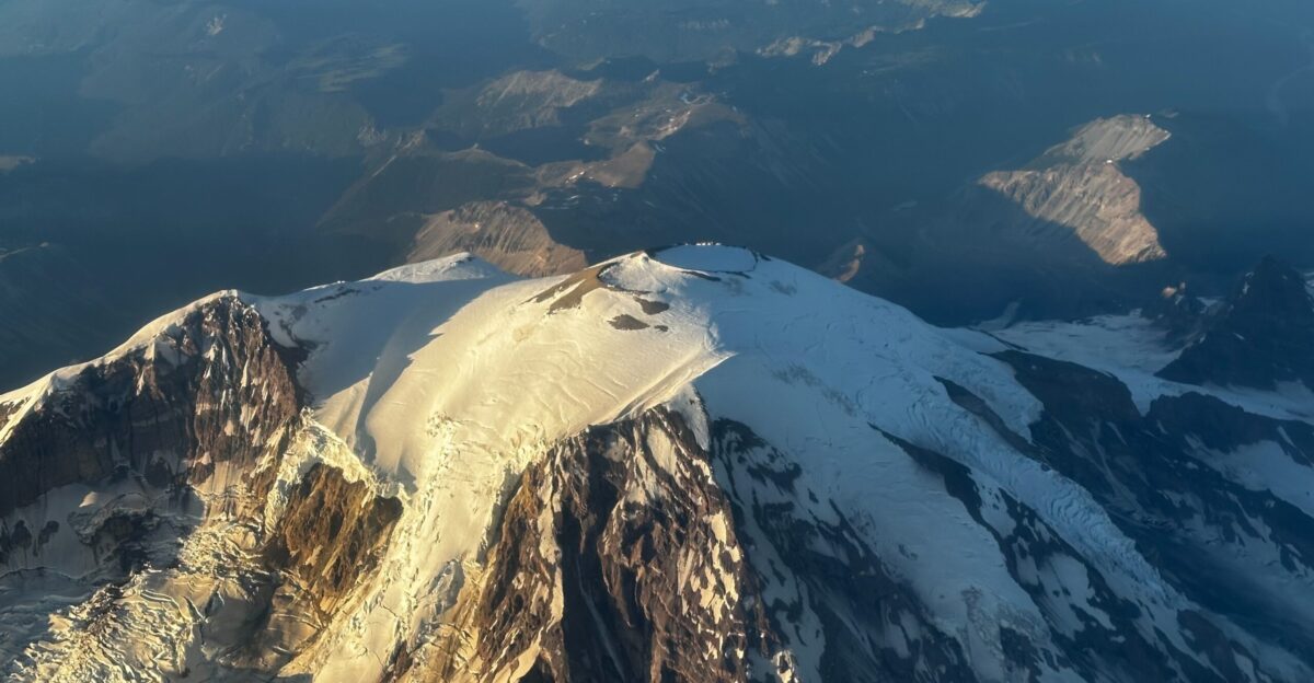 The summit area of Mount Rainier Washington seen from an airplane in July 2024