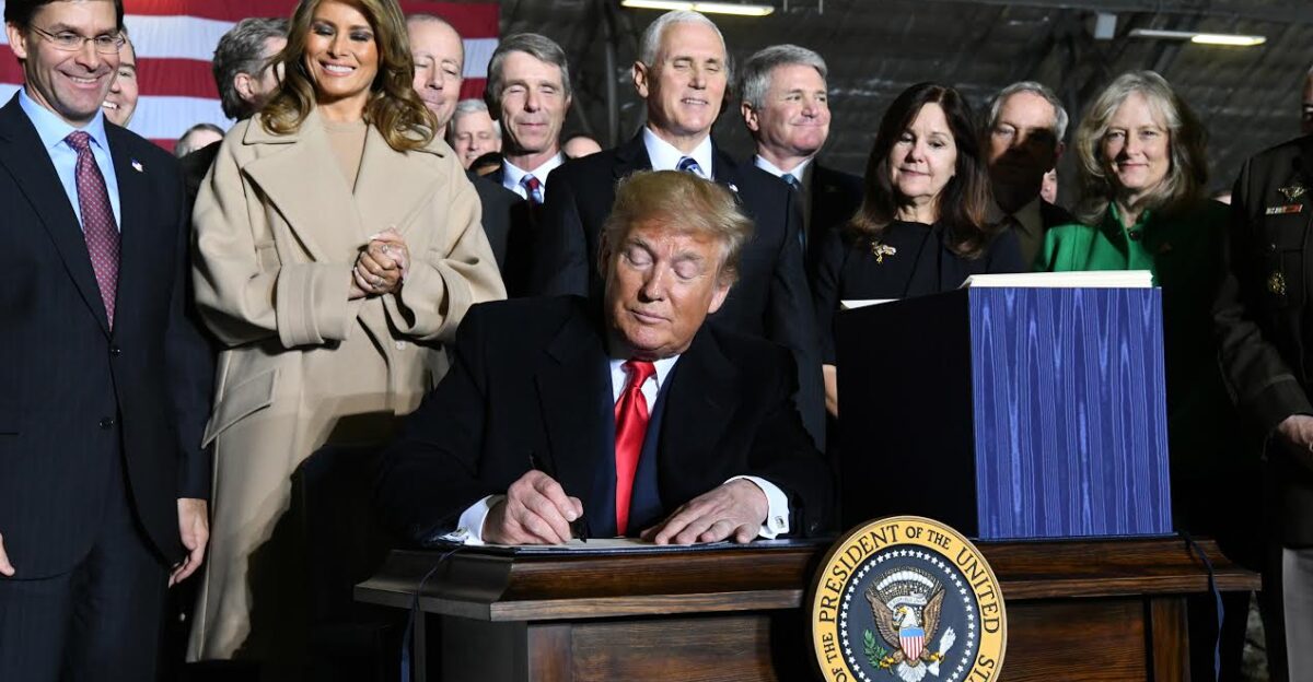 President Donald Trump signs S 1790 the National Defense Authorization Act for Fiscal Year 2020 as senior leaders look on Friday Dec 20 2019 At Joint Base Andrews The act authorizes a budget that supports the U S armed forces and postures the Air Force to meet the requirements of the National Defense Strategy U S Air Force photo by Airman 1st Class Spencer Slocum