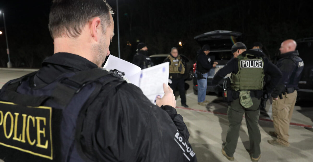 Officers with U S Immigration and Customs Enforcement arrest fugitives as part of Operation Cross Check in Dallas Texas