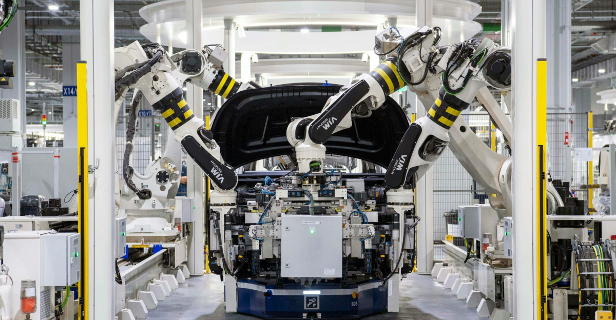 High-tech robots assembling a car in a modern factory setting, showcasing automation.