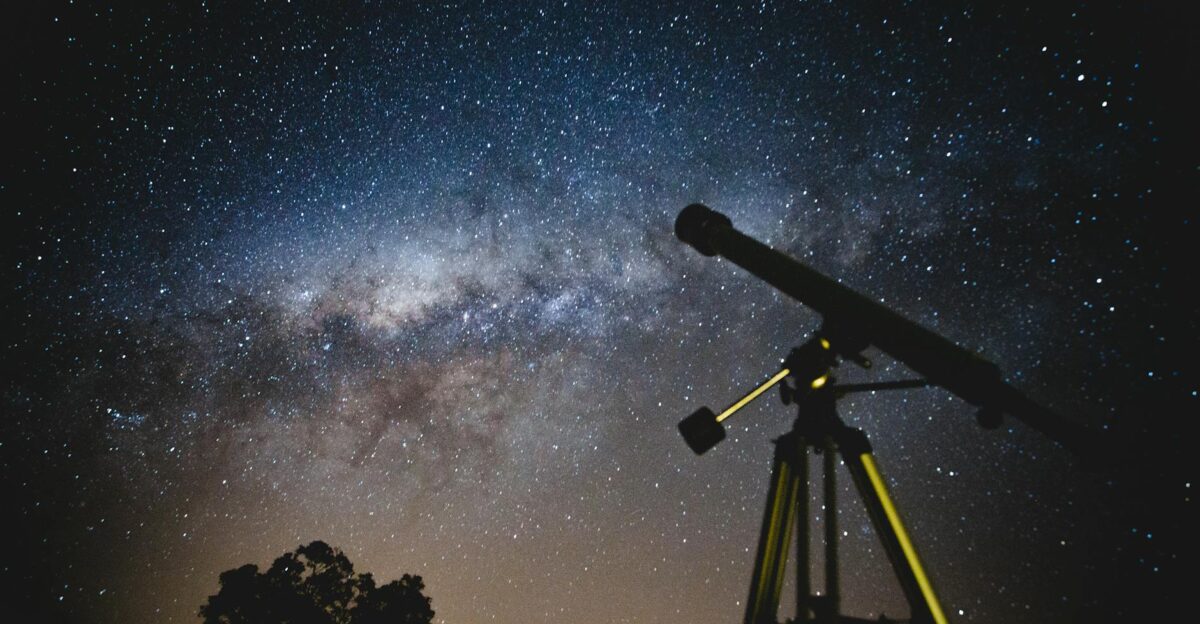 Stunning starry sky with silhouette of telescope capturing the Milky Way in Brazil