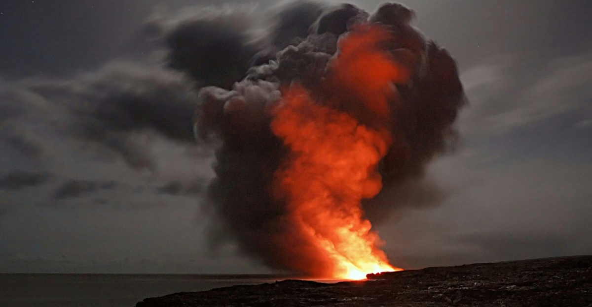 Volcanic eruption with smoke and lava under a starry night sky.