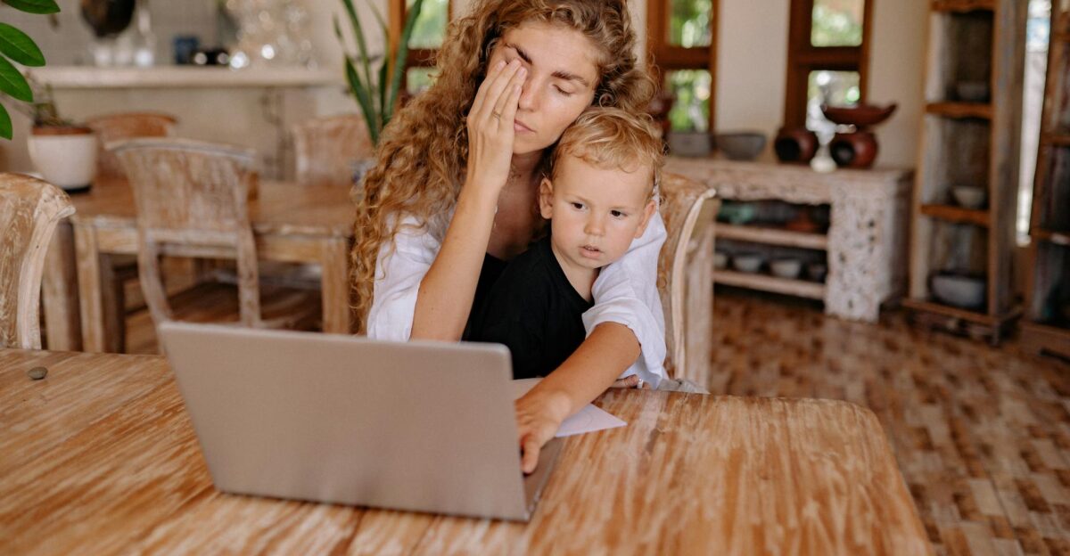 Woman multitasking while working from home with child Relaxed ambiance