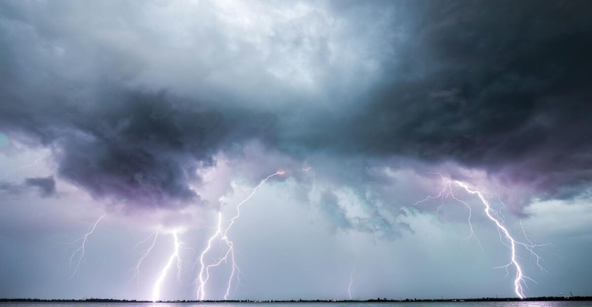 Captivating lightning strikes illuminate the sky over water during an Oklahoma storm