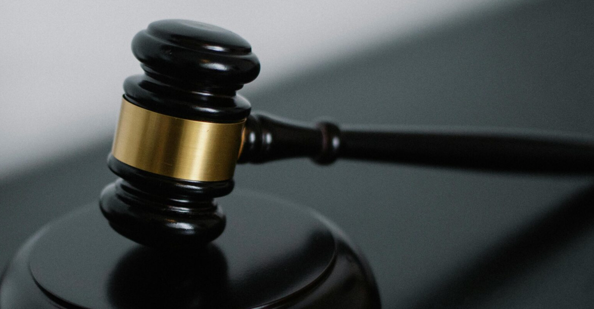 Close-up of a wooden gavel on a desk, symbolizing justice and legal authority.