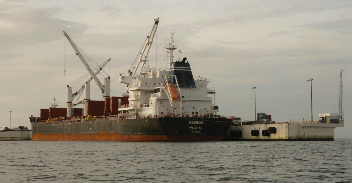 A large cargo ship docked at Acajutla Harbor in El Salvador showcasing maritime industry