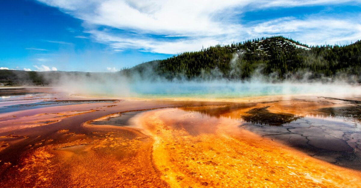geyser within mountain range during daytime