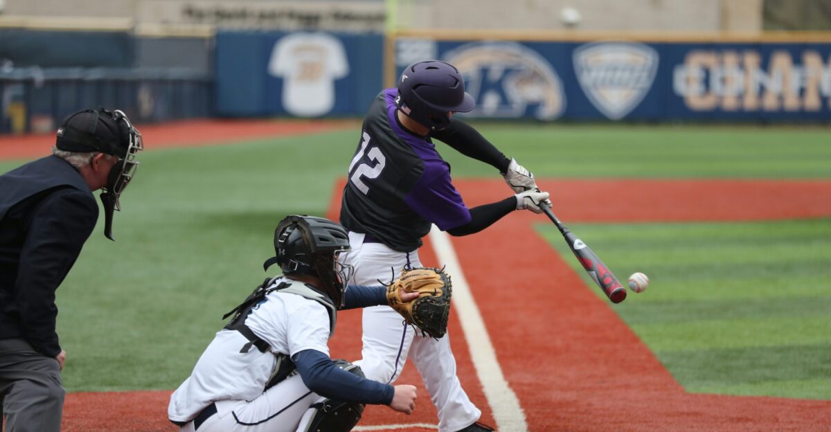 baseball player swinging bat