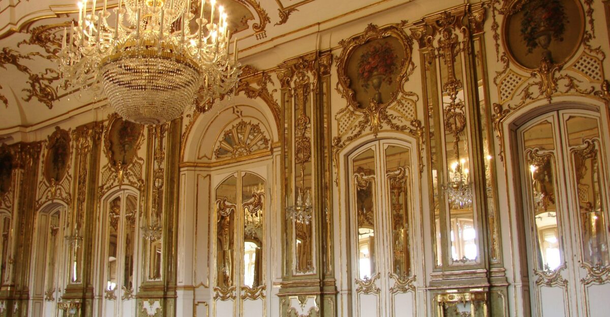lighted chandelier inside white and brown building