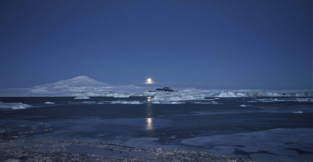 body of water under clear blue sky
