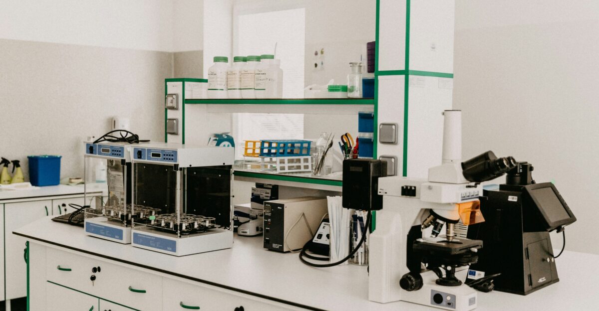 black and silver coffee maker on white wooden table