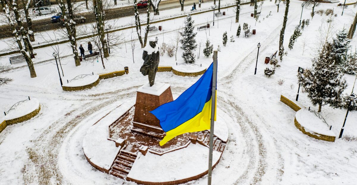 blue and yellow flag on brown wooden table