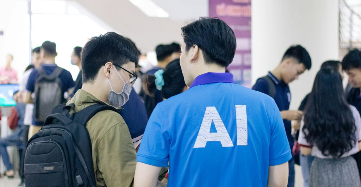 man in blue crew neck t-shirt standing near people