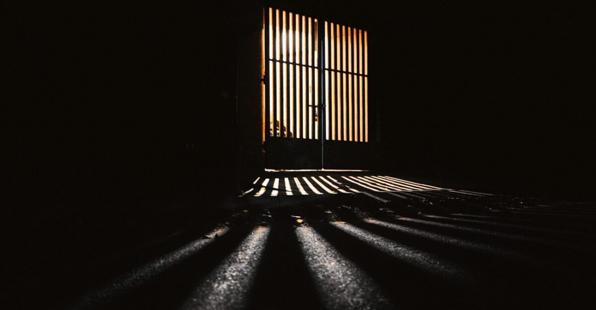 the sun is shining through a window in the dark