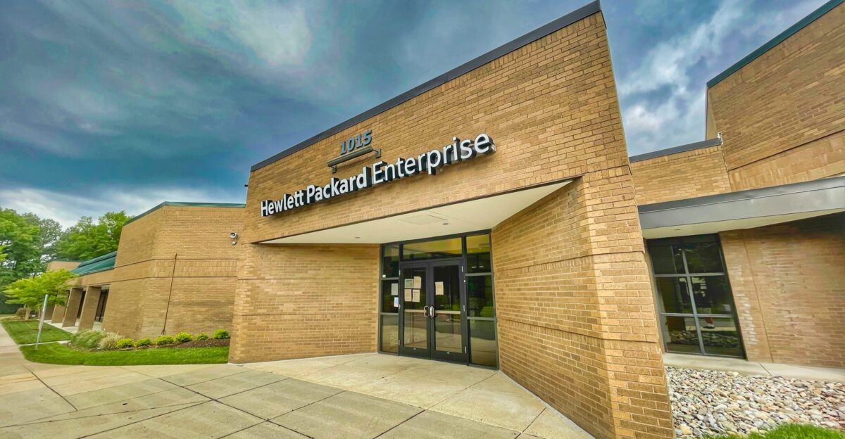 brown and white concrete building under blue sky during daytime
