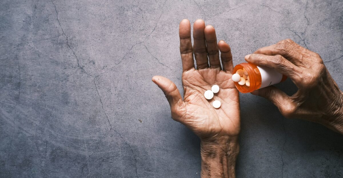 person holding white round ornament