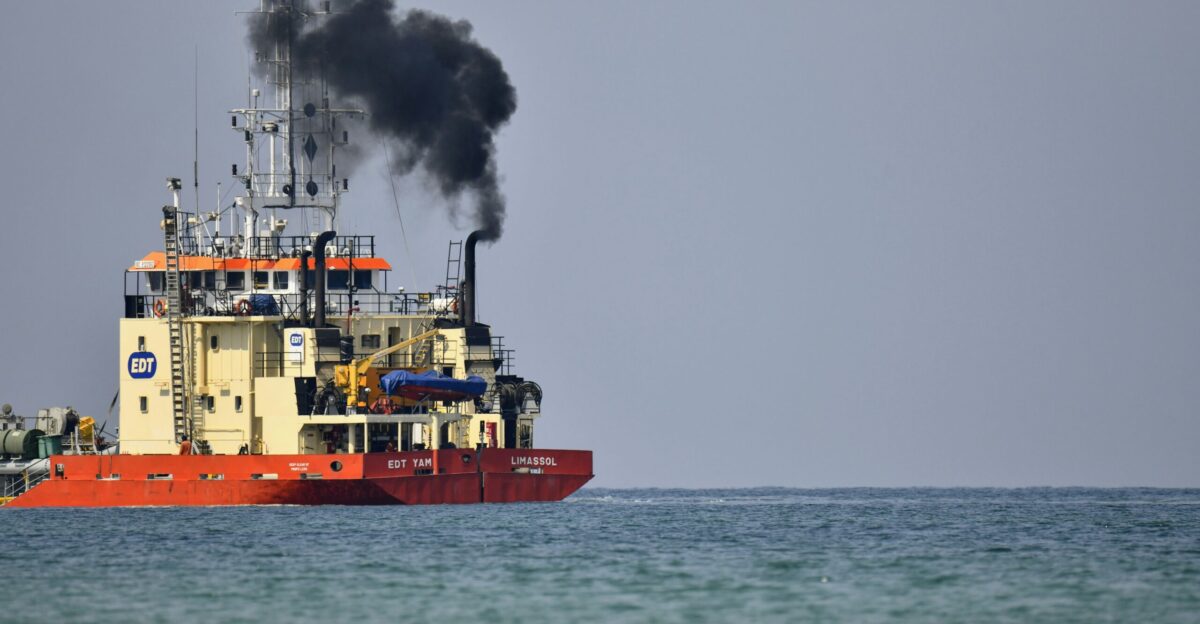 red and white ship on sea during daytime