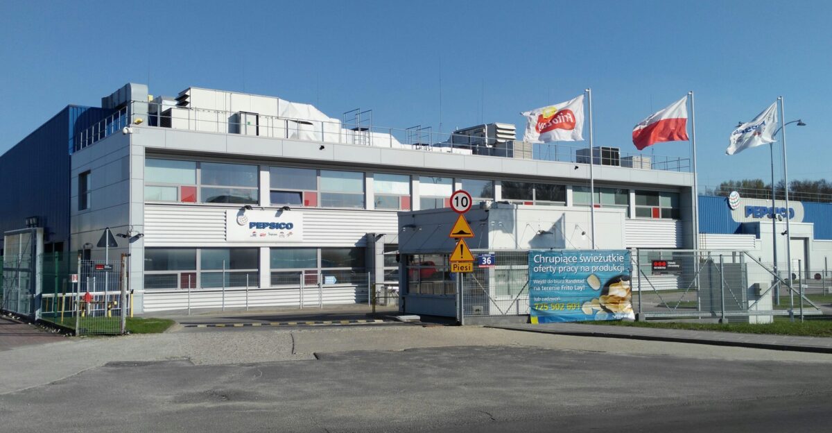 a large building with flags on top of it