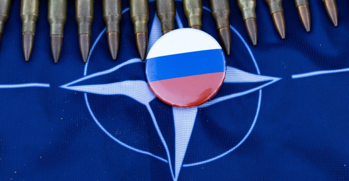 a close up of a bunch of pens and a pin